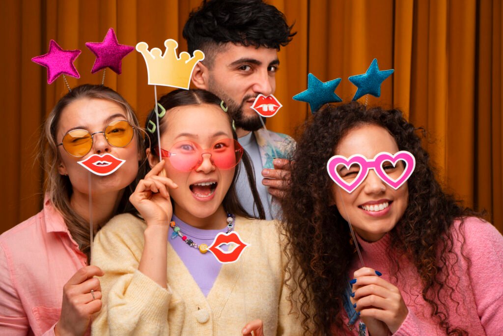 medium shot friends posing photo booth (1)